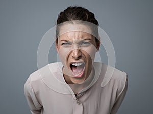 Aggressive woman yelling at camera