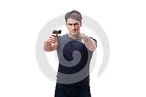 The aggressive young man with gun isolated on white