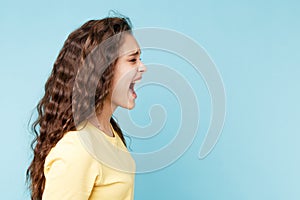 Aggressive young woman screaming isolated.
