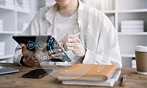 Agile development methodology concept. male hand using laptop computer and tablet with virtual screen agile icon on modern office