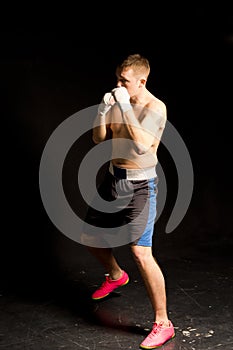 Agile young boxer on the move in the ring