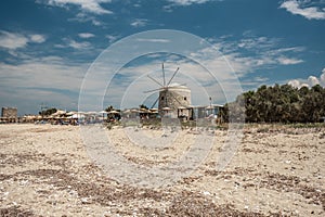 Agios Ioannis beach in Lefkada island Greece. Old windmill