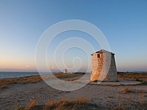 Agios Ioannis beach and a tower in Lefkada, Greece
