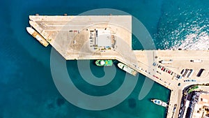 Agios Nikolaos. Crete. Greece. Buildings on the shore of Voulismeni Lake and boats at the pier