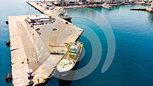 Agios Nikolaos. Crete. Greece. Buildings on the shore of Voulismeni Lake and boats at the pier