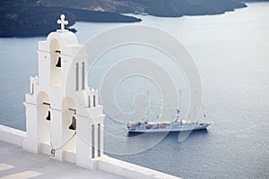 Agios Theodori belltower with cruise ship in background, Santorini island