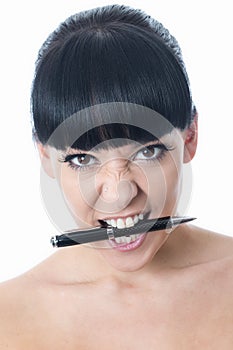 Agitated Stressed Frustrated Young Woman with Pen in Mouth