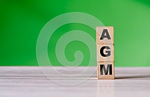 AGM business word on wooden cube shape with copy space. Business