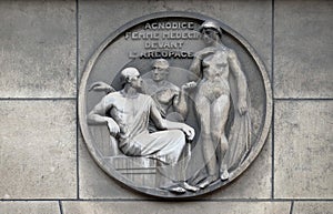 Agnodice, female doctor in front of the Areopagus. Stone relief at the building of the Faculte de Medicine Paris