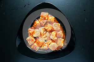 Agnolotti served in a dish isolated on dark background top view of italian food