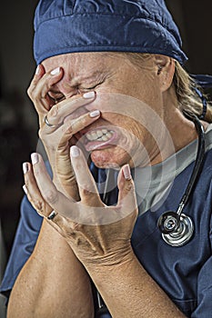 Agonizing Crying Female Doctor or Nurse photo