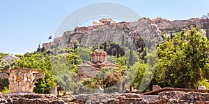 Agora in Athens, Greece. Panoramic view of ancient Greek ruins and Acropolis in distance