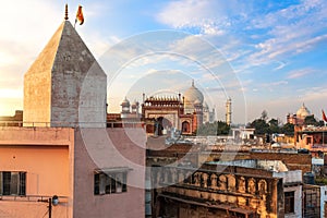 Agra deprived area and view on the Taj Mahal gate, India