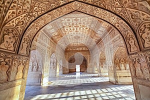 Agra Fort royal palace interior medieval architecture with intricate wall artwork and carvings.at Agra India