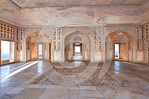 Agra Fort white marble medieval royal palace interior architecture with stone carvings at Agra India