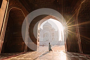 tourist standing in front entrance gate of Taj Mahal indian palace. Islam architecture. Door to the mosque