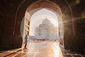 tourist standing in front entrance gate of Taj Mahal indian palace. Islam architecture. Door to the mosque