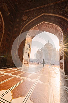 tourist standing in front entrance gate of Taj Mahal indian palace. Islam architecture. Door to the mosque