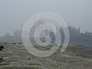 Agra, Uttar Pradesh, India - 08 Jan 2021 : Sunrise and morning fog at the Taj Mahal in Agra - India