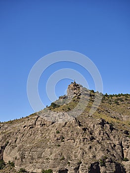 The Agrado Corazon de Jesus Statue on top of the El Santo Peak in the Gibralamora Mountain Range near to Pizarra in Andalucia. photo