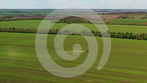 Agrarian, agricultural machinery, work in the field. Aerial photography.