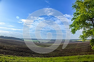 Agrarian fields after heavy rain, deposits of chernozem and various debris on the field