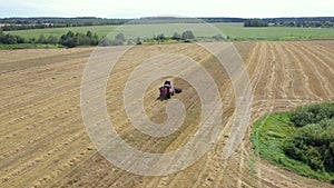 Agricultural Combine Machine Harvest Grain Crops On Rural Field Aerial View