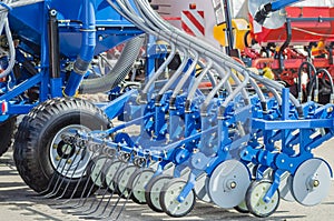 Agricultural cultivator for the processing of land