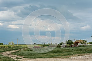 Agricultural equipment on a background of gloomy sky