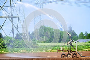 Agricultural field irrigation, Irrigation system for irrigating crops Waters the freshly sown field. Irrigation equipment