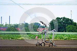 Agricultural field irrigation, Irrigation system for irrigating crops Waters the freshly sown field. Irrigation equipment