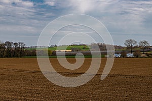 Agricultural fields in the hillside dutch: Heuvelland in the south of the Netherlands with amazing views over the landscape duri