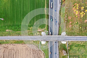 Agricultural fields. road intersection with cars traffic. aerial view