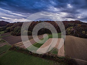 Agricultural fields under moody sky