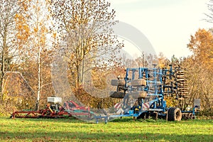 Agricultural implements standing in a farm