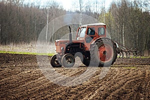 Agricultural land in the fieldagricultural tractor plows the land