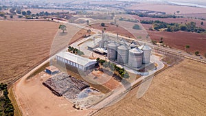 Agricultural land with grain storage silos.