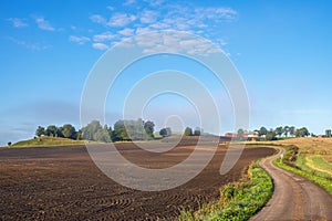 Agricultural land view with a winding country road