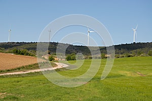 Wind turbines in agricultural landscape, Castilla-La Mancha, Spain photo