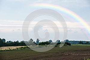 Agricultural landscape with vegetable plantations in the Netherlands. Landscape after the rain with rainbow