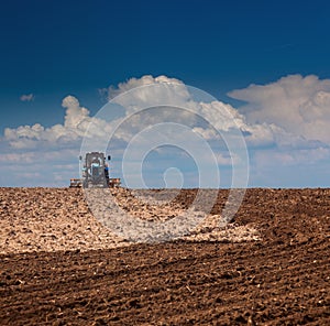 Agricultural Lanscape - Tractor working on the field