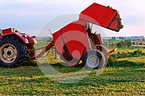 Agricultural machine for gathering hay and straw, stacker differently, harvester