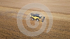 Agricultural machine working in field to harvest wheat, Process of harvesting