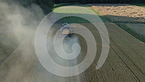 Agricultural machine working in field to harvest wheat, Process of harvesting