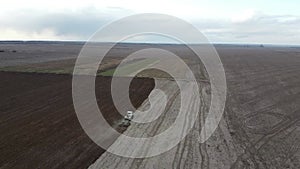 Agricultural machinery in the field, aerial view. Agricultural work.