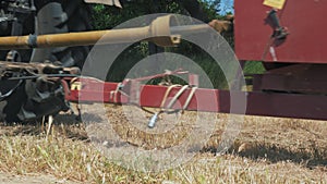 Agricultural machinery harvested hay on the field.