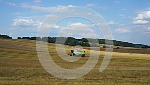 Agricultural machinery is harvesting. Combine harvester work in the field.