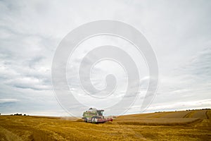 Agricultural machinery for harvesting. Farm field of ears of  grain