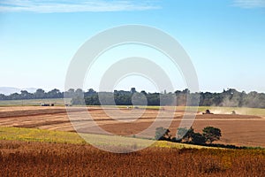 Agricultural machinery harvesting soybeans.