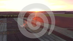 Agricultural Machinery Harvests In Rural Wheat Field Aerial View